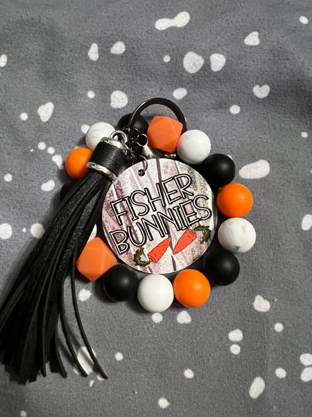 Fisher Orange, Black, and White Wristlet